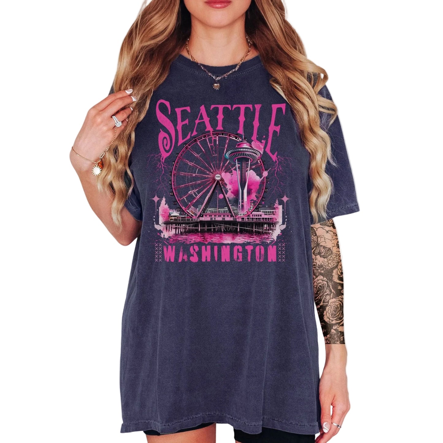 Navy blue t-shirt with pink 'Seattle Washington' graphic design worn by a model on a white background