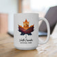 White mug with a colorful leaf design and 'North Cascades National Park' text on a wooden surface.