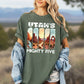 Person wearing a green t-shirt with 'Utah's Mighty Five' design 