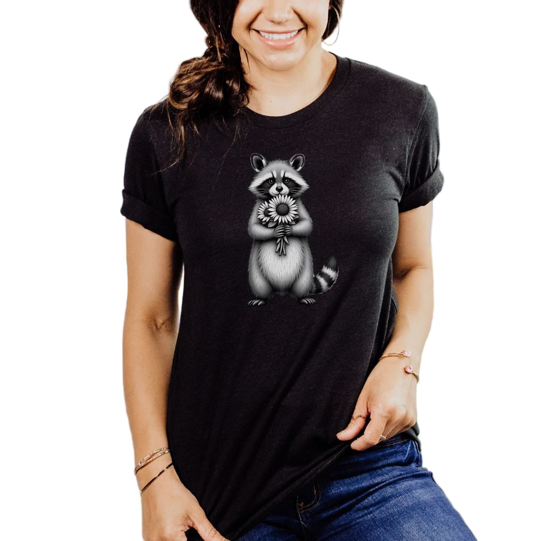 A woman wearing a black t-shirt with a graphic of a raccoon holding sunflowers.