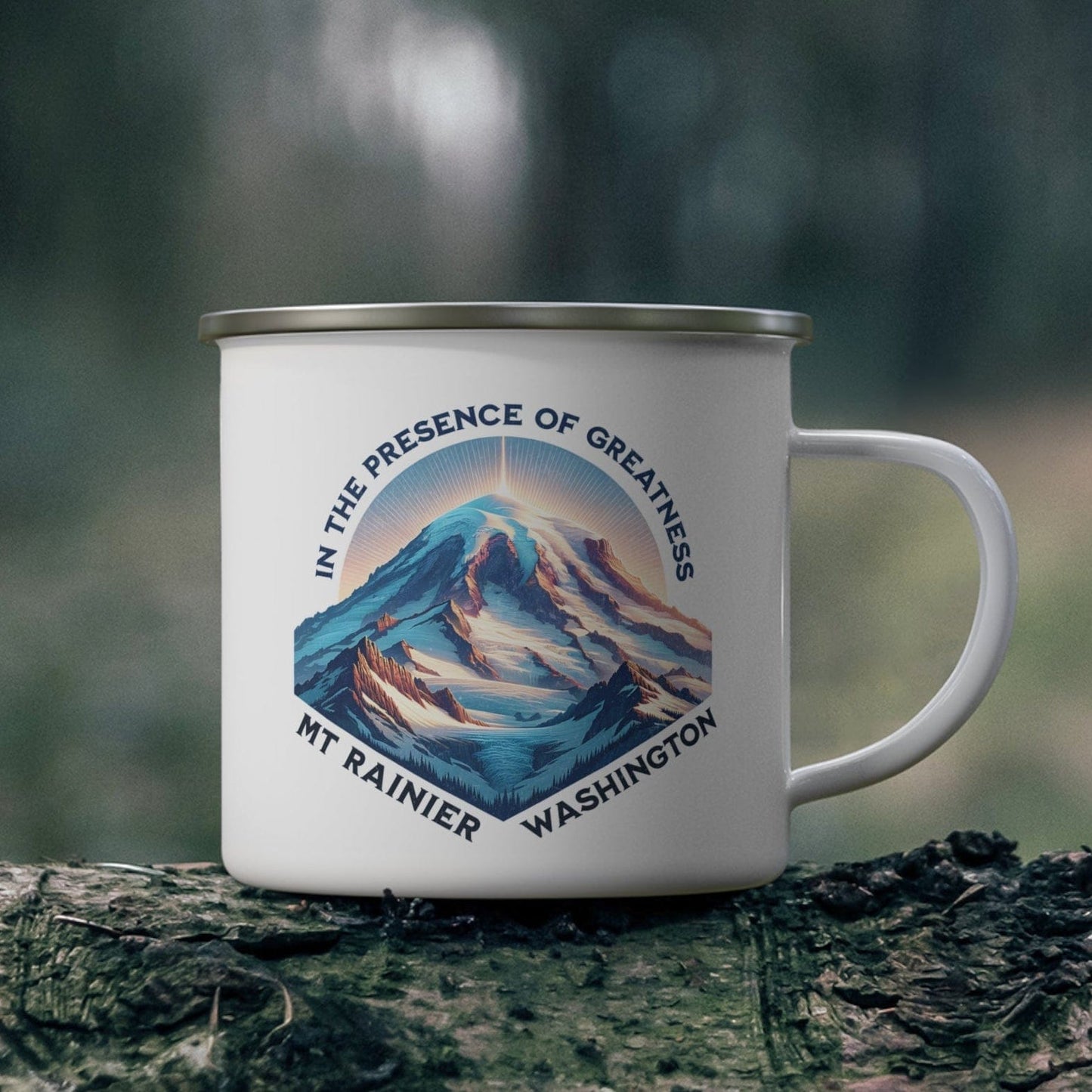 Mug with mountain design and text on a log in a forest setting