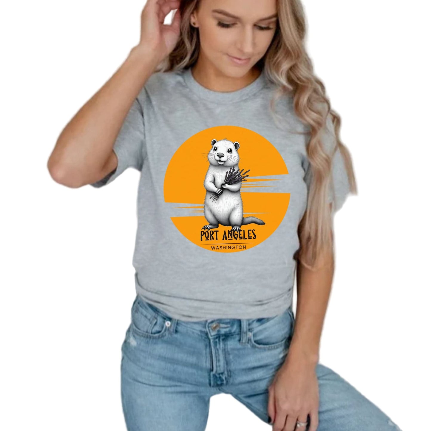 Person wearing a gray t-shirt with a graphic of a marmot and text that says, Port Angeles, Washington.