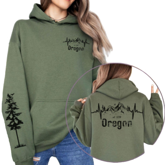 Green hoodie with 'Oregon' design, front and back, against a natural background.