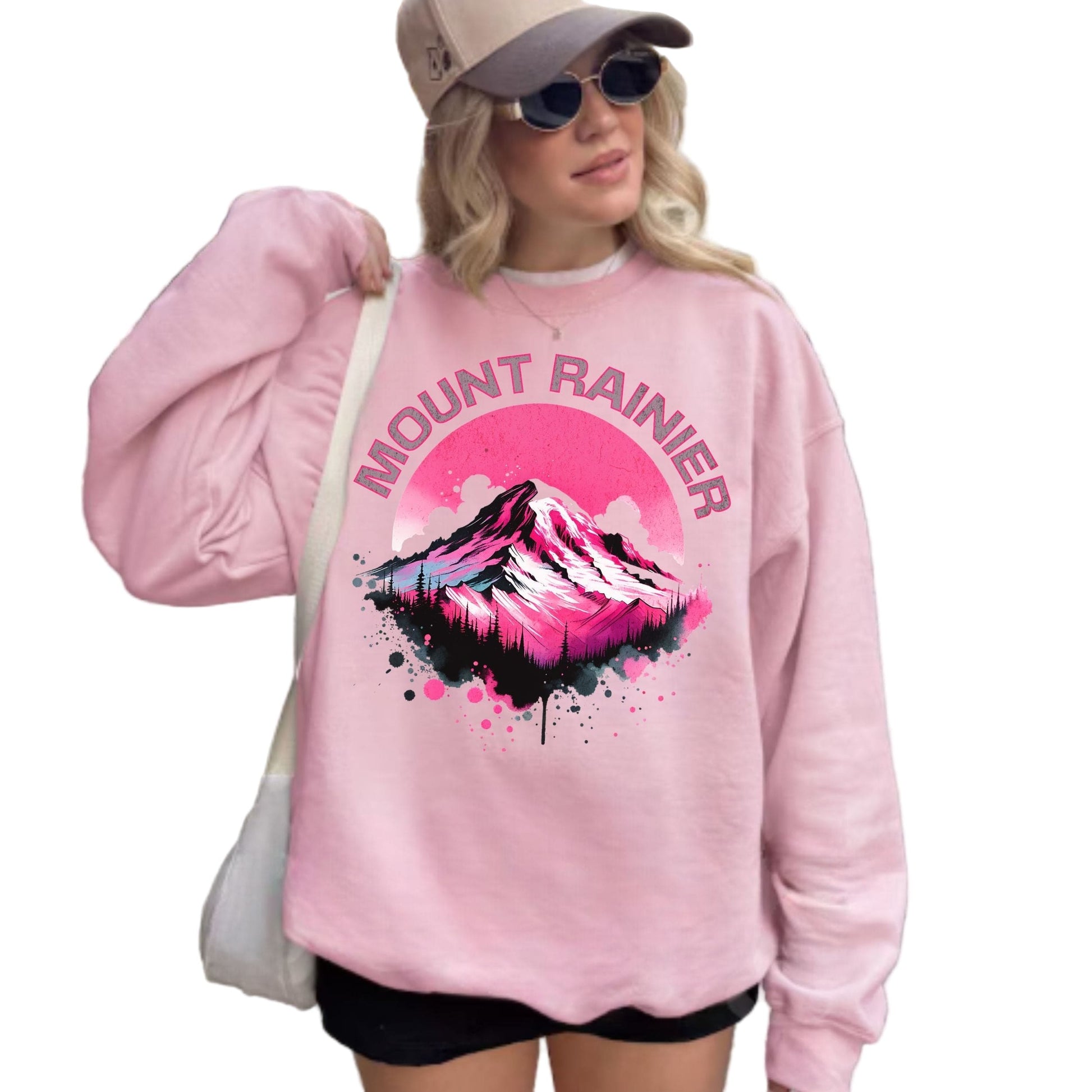 Person wearing a pink sweatshirt with Mount Rainier design.