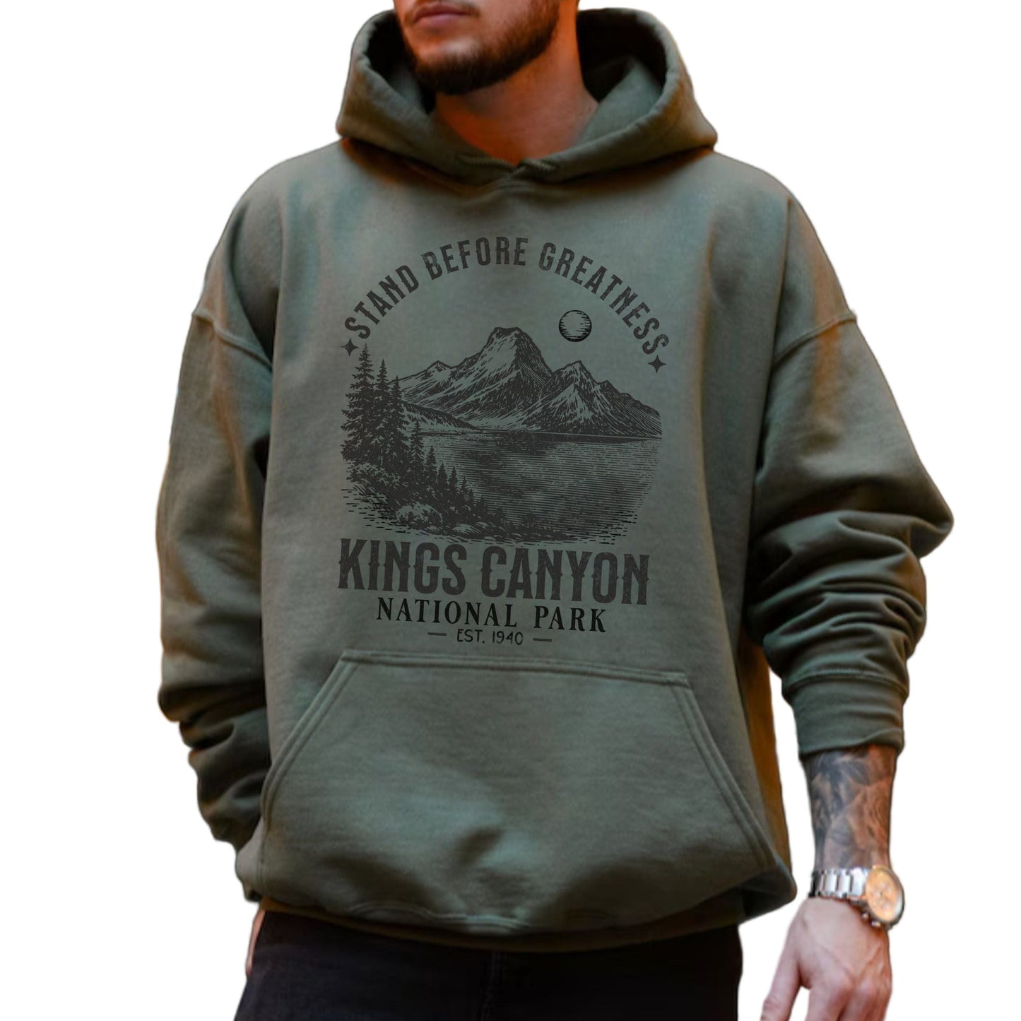 Person wearing a green hoodie with Kings Canyon National Park design.