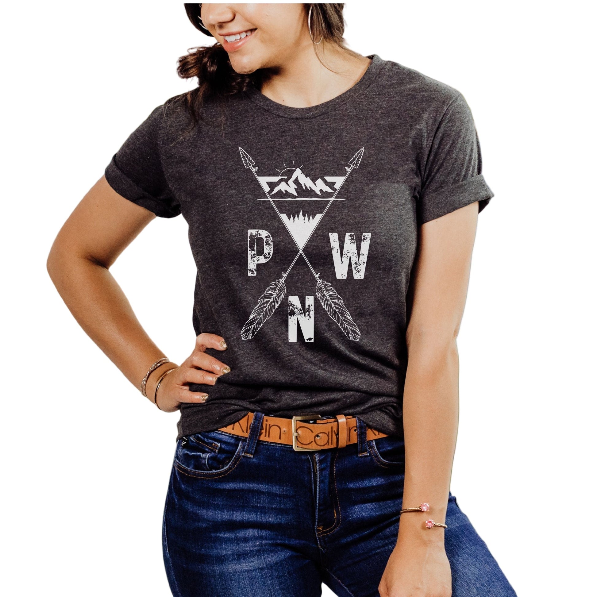 Person wearing a dark gray t-shirt with a PNW arrows design on the front.