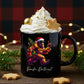 A black ceramic mug filled with whipped cream, gold sprinkles, a cookie, and a star cookie, set on a wooden surface with holiday lights, pine branches, and a red plaid backdrop. The mug features a graphic of Bigfoot in a Santa hat and jeans dancing with a Christmas tree, with the text 'Pacific Northwest' below.
