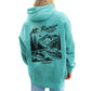 Person wearing a teal hoodie with a graphic of Mount Rainier National Park on the back.