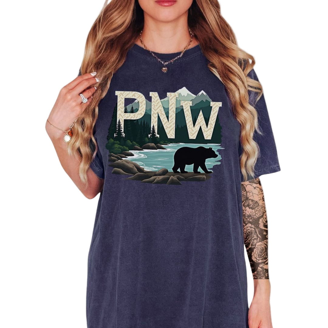 Navy blue t-shirt with PNW graphic featuring a bear and mountains on a white background