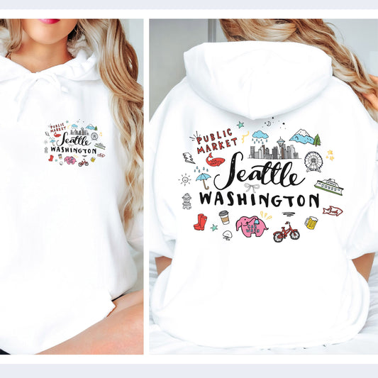 A white pullover hoodie shown on a model from both the front and back. The front features a small multicolor graphic on the left chest reading 'Seattle Washington'.