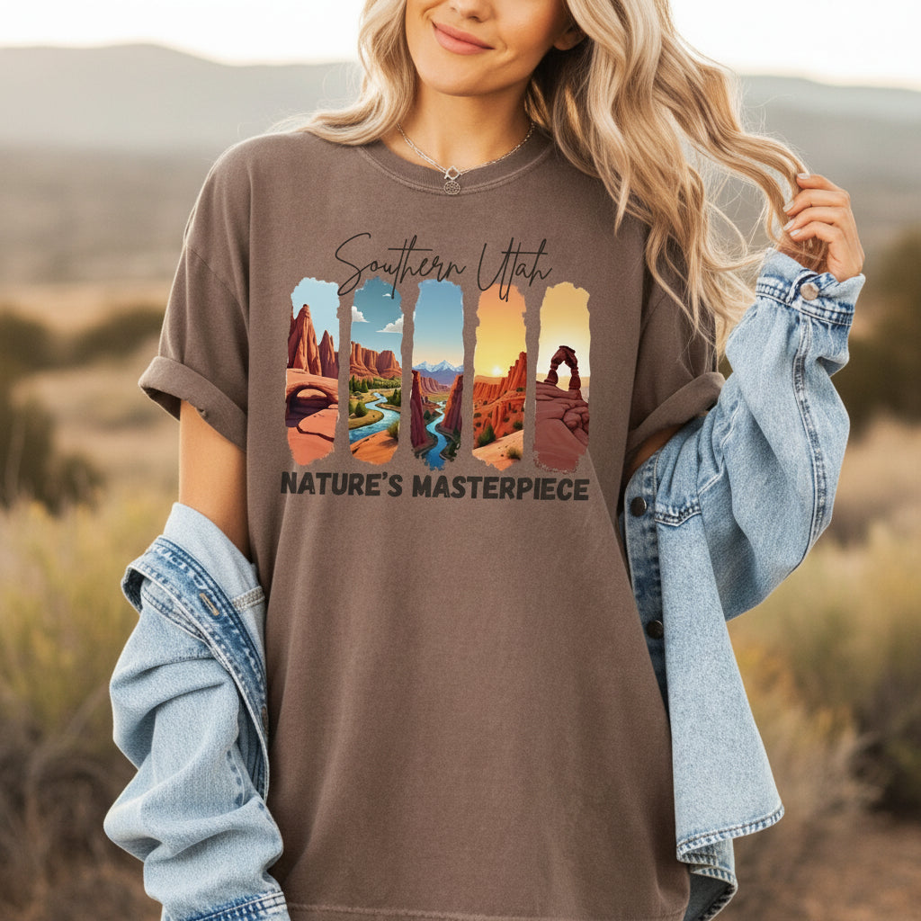 Woman wearing a brown t-shirt with 'Southern Utah Nature's Masterpiece' design, holding a denim jacket.