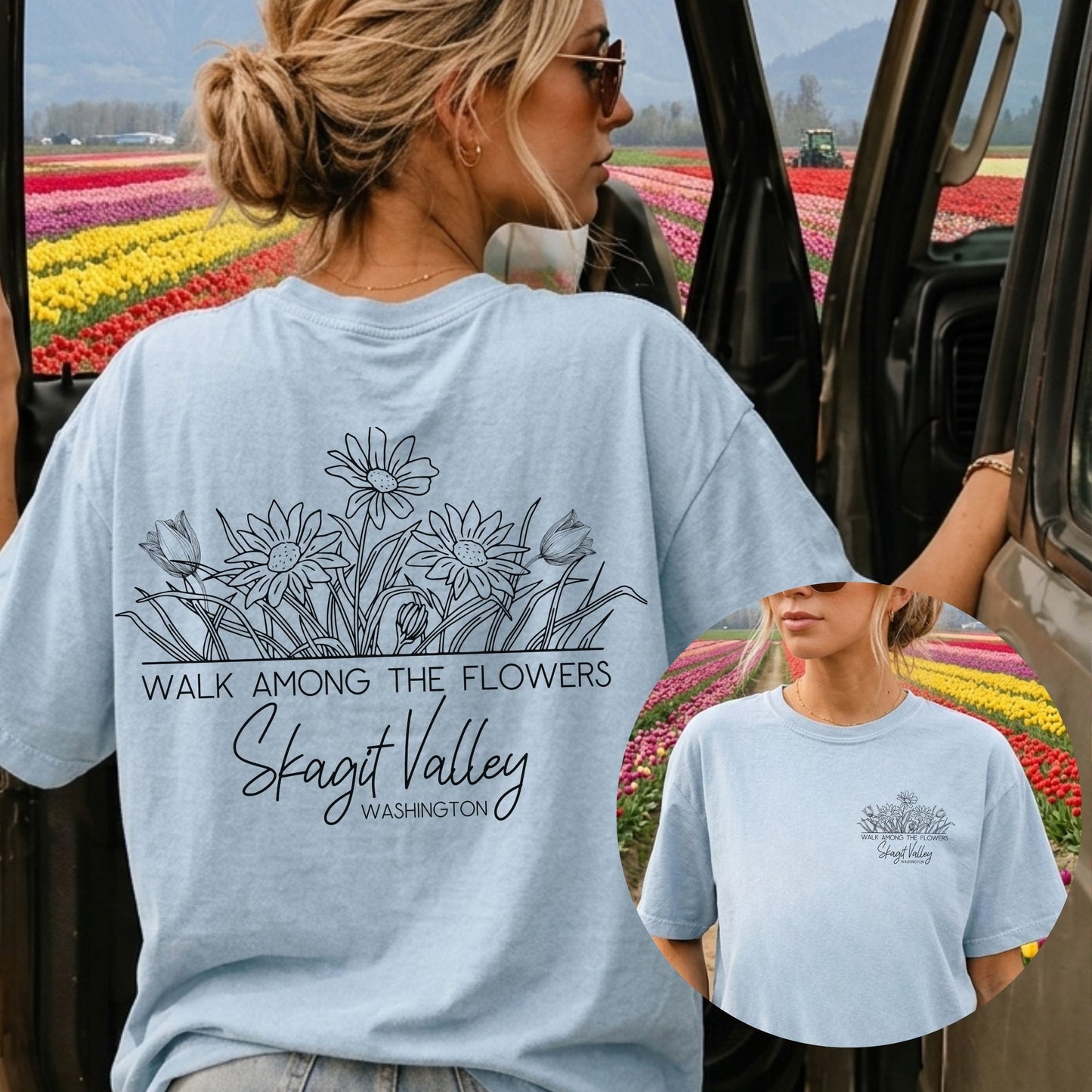 A woman wearing a light blue graphic T-shirt stands beside a car door with a tulip field in the background. The shirt has a black floral line drawing and the text 'WALK AMONG THE FLOWERS', 'Skagit Valley', and 'WASHINGTON'.